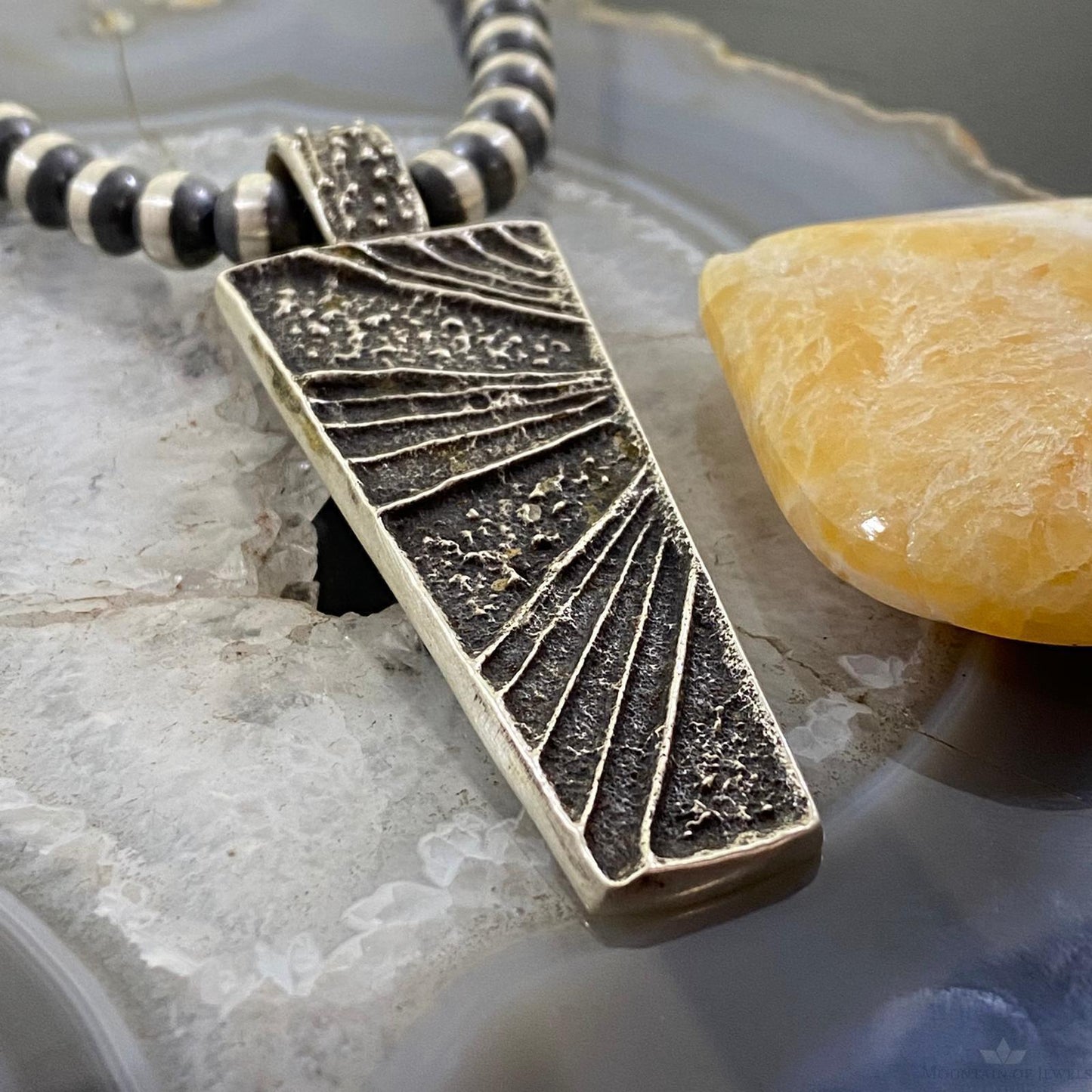 Cheyenne Custer Navajo Sterling Silver Trapeze Decorated Tufa Cast Uni Pendant