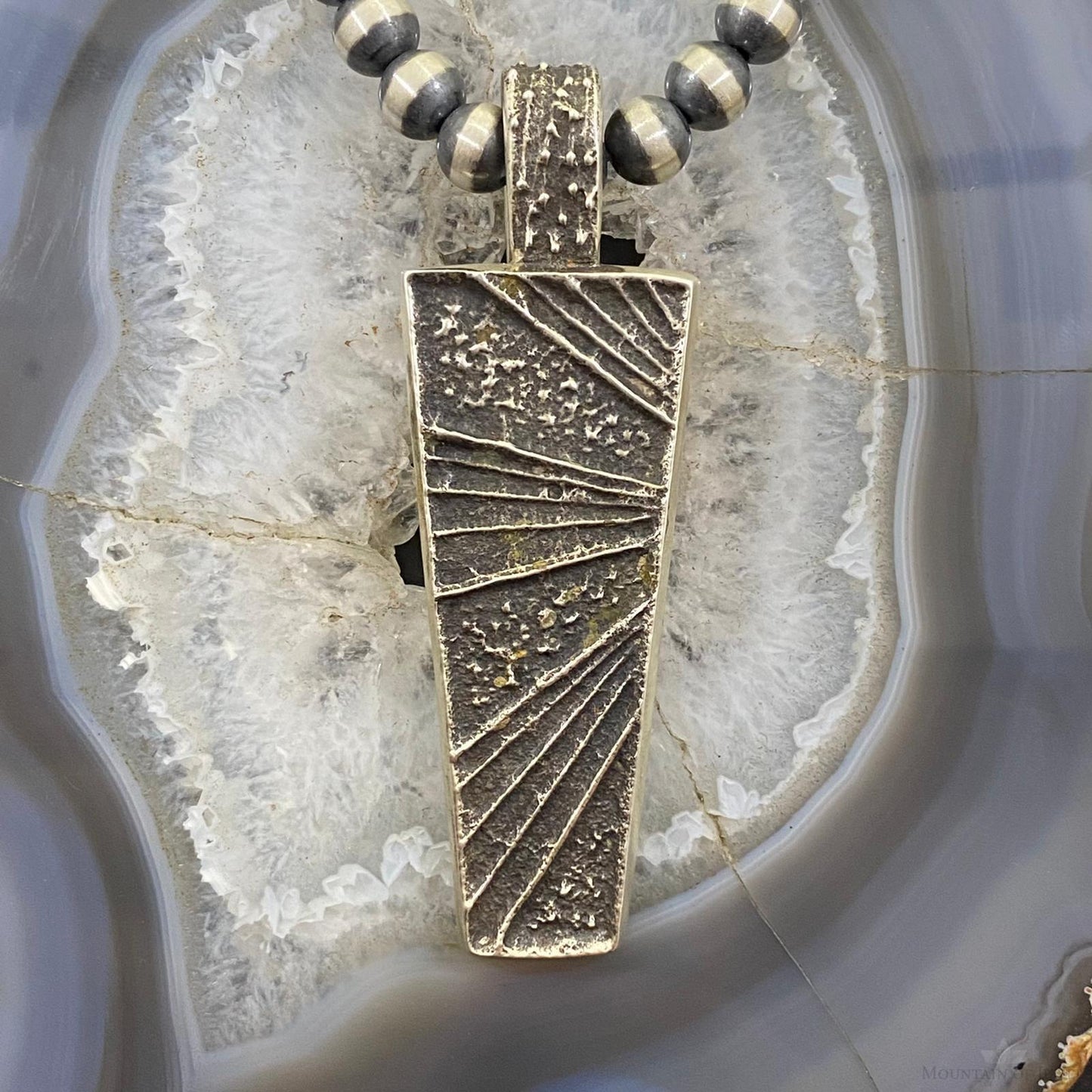 Cheyenne Custer Navajo Sterling Silver Trapeze Decorated Tufa Cast Uni Pendant