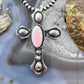 Richard Yazza Sterling Silver Oval Pink Conch Decorated Unisex Cross Pendant