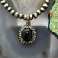 Sterling Silver Southwestern Style Oval Onyx Decorated Charm/Pendant For Women