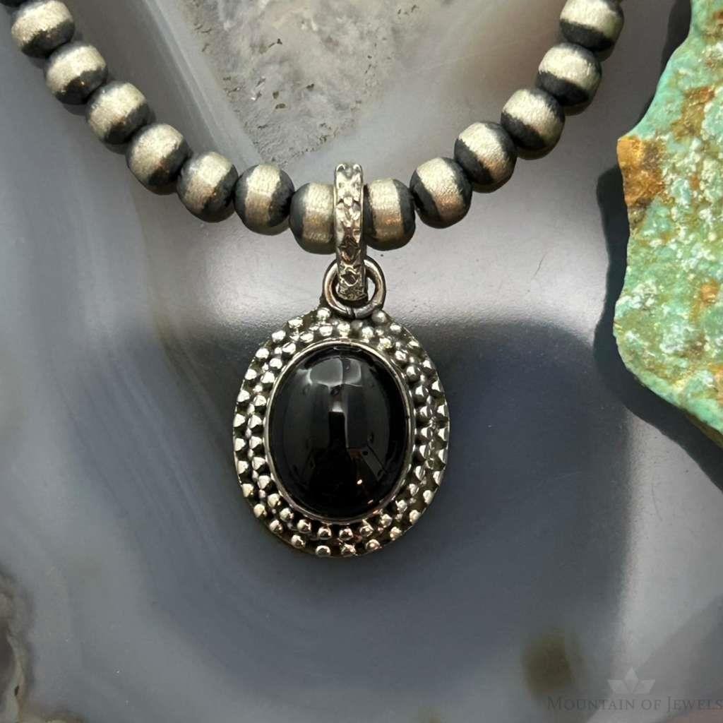 Sterling Silver Southwestern Style Oval Onyx Decorated Charm/Pendant For Women