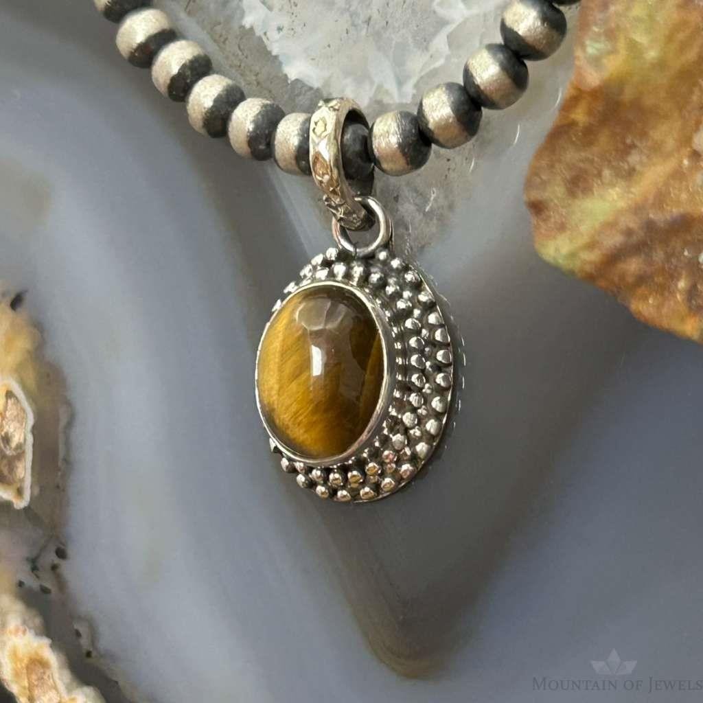 Sterling Silver Southwestern Style Oval Tiger's Eye Decorated Charm/Pendant For Women