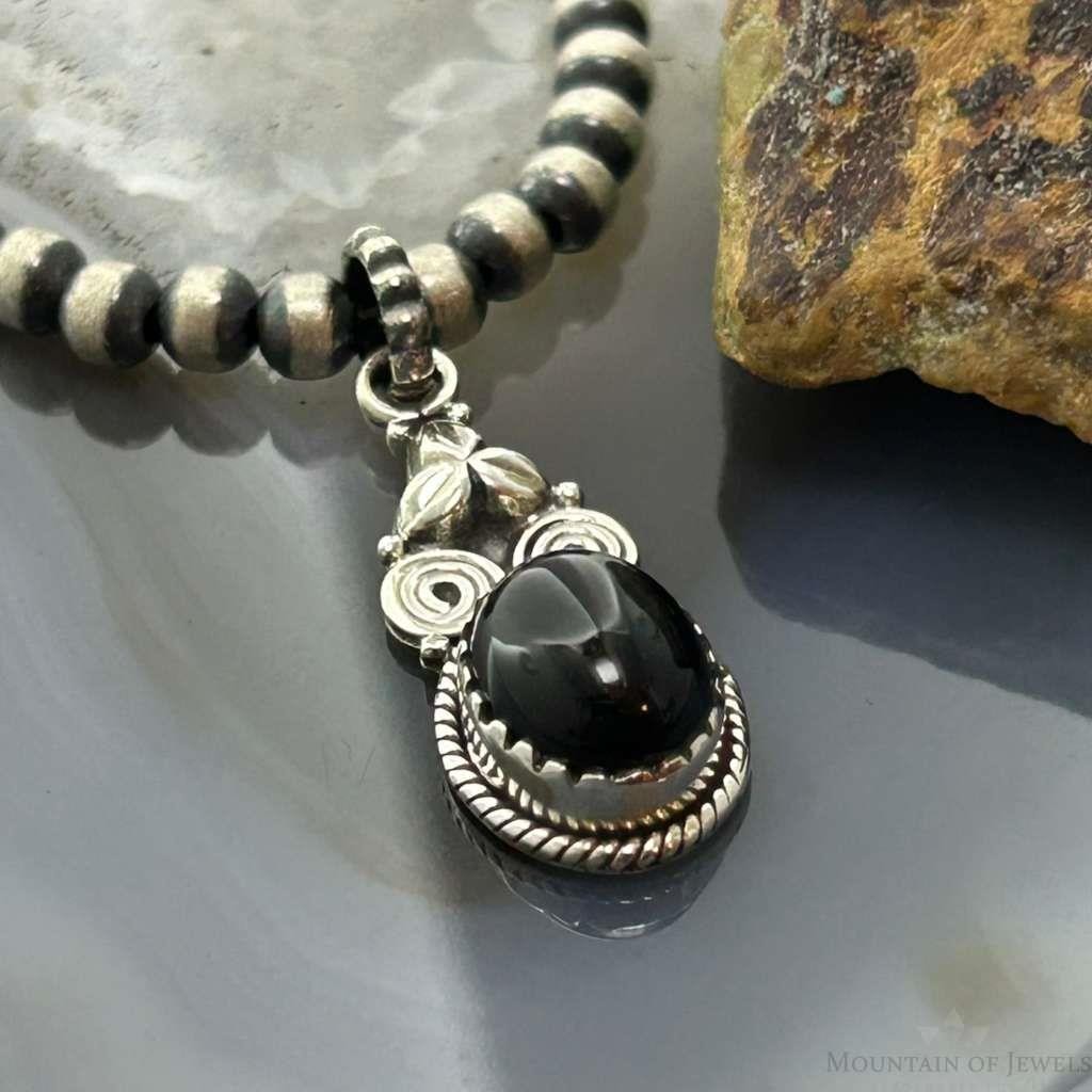 Sterling Silver Southwestern Style Oval Onyx Decorated Charm/Pendant For Women