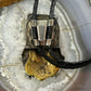 Sid Bell Tully NY Bronze & Pewter Man Inside Bear Decorated Bolo Tie For Men