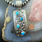 Delbert Secatero Curved Decorated Turquoise Sterling Silver Unisex Pendant - Mountain Of Jewels